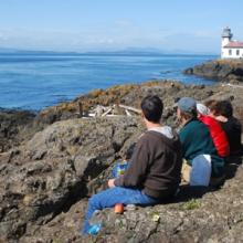 Students near lighthouse in Friday Harbor