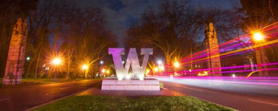 Decorative image of the W at the north entrance to campus
