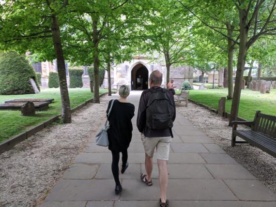 Jessica Burstein and Peter Buckroyd approaching Shakespeare's grave in Stratford.  Photo Owen Crandall