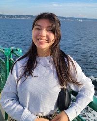 Photo shows dark-haired woman on a ferry