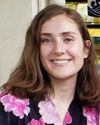 white woman with brown hair smiling 