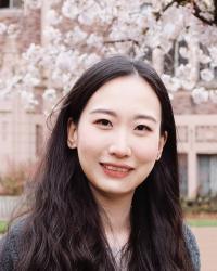 Picture of Yixuan Jiang in front of cherry blossoms