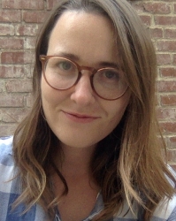 white woman with brown hair and glasses