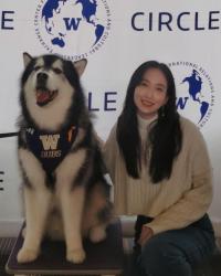 Photo of Yixuan Jiang with Dubs the husky