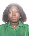 A professional headshot of Mwinkuma in a green shirt 