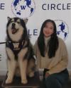 Photo of Yixuan Jiang with Dubs the husky