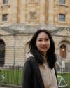 Asian woman in front of English library
