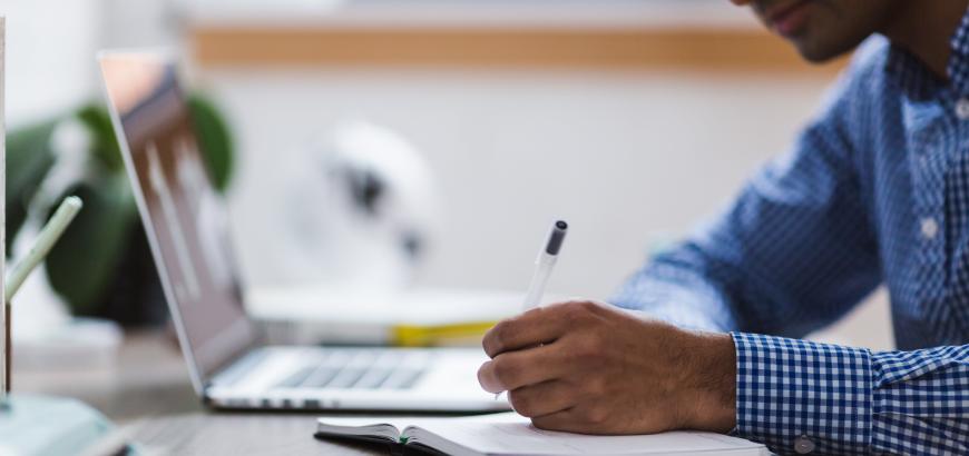 Decorative image of a person writing